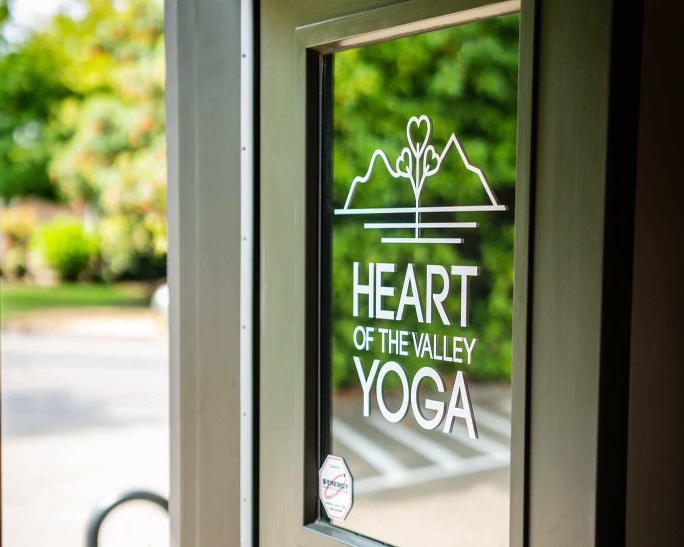 The studio front door with the Heart of the Valley logo on the glass.